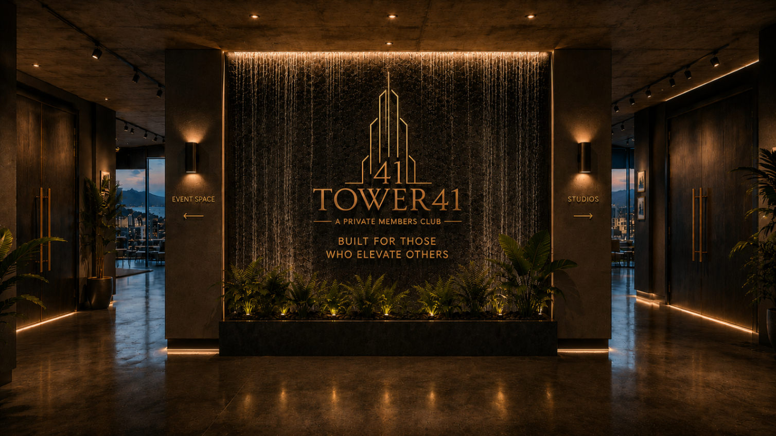 Tower41 main entrance with illuminated gold branding and dark stone water wall